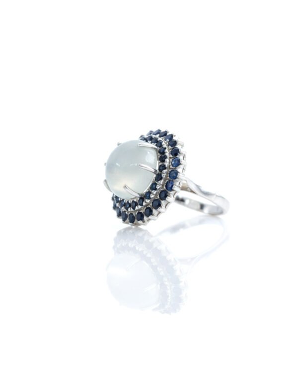 Side view of Sri Lankan Moonstone and Blue Sapphire Silver Cocktail Ring highlighting intricate silverwork and gemstone setting handmade in Sri Lanka.