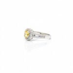 Side view of 925 silver yellow sapphire halo ring with American diamond accents and split shank band