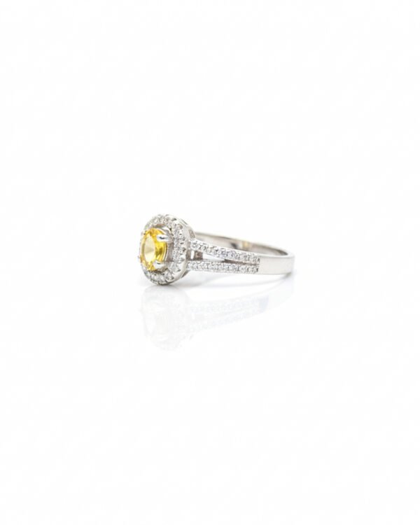 Side view of 925 silver yellow sapphire halo ring with American diamond accents and split shank band