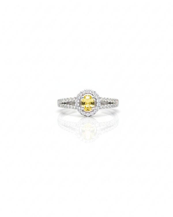 Front view of 925 silver yellow sapphire halo ring with oval gemstone and American diamonds on split shank design