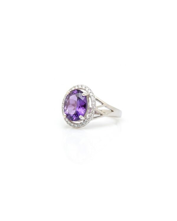 Side view of silver halo ring with Amethyst gemstone and American Diamonds