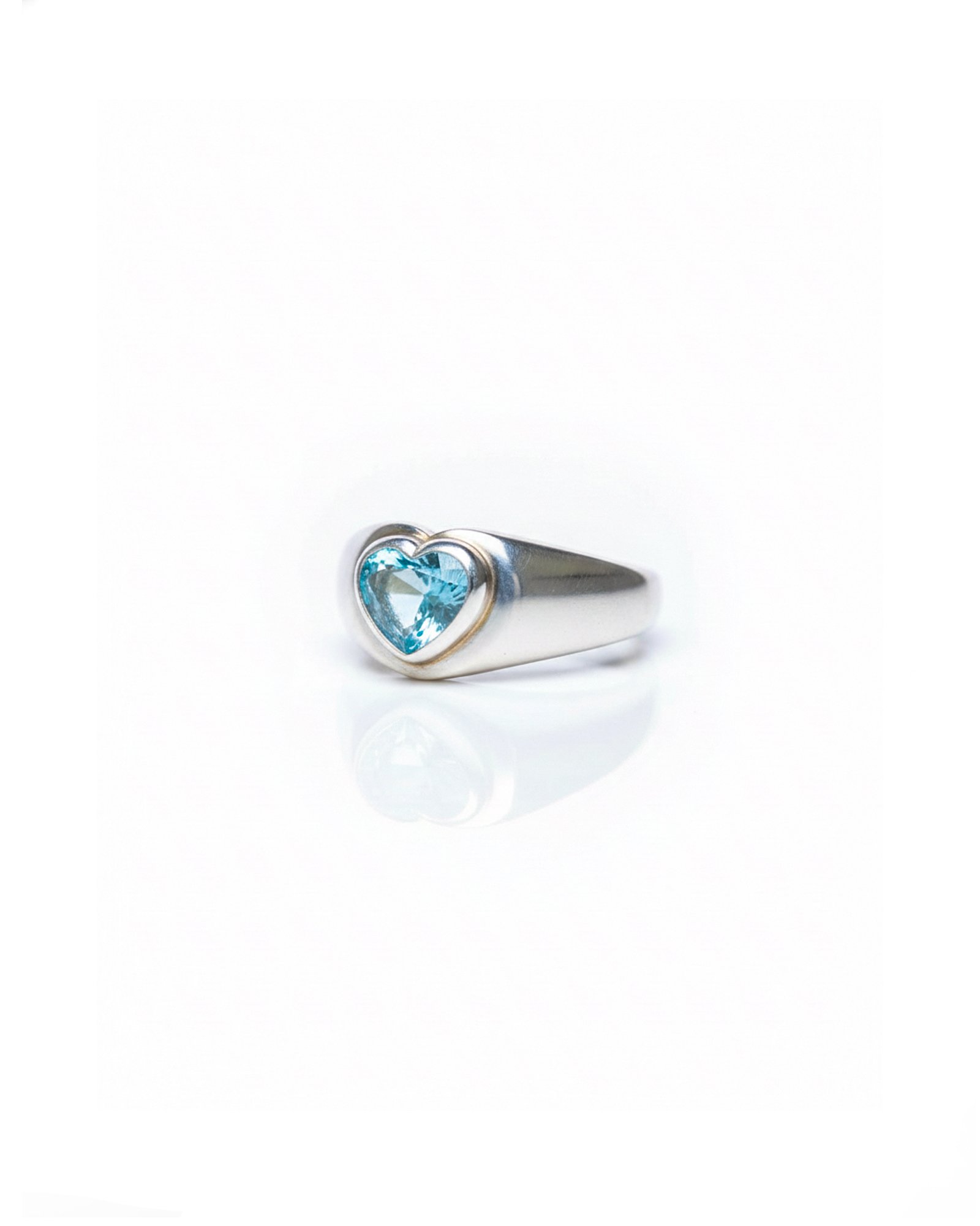 Side view of 925 silver Blue Topaz Heart Dome Ring highlighting chunky dome band and heart-shaped gemstone – L66646