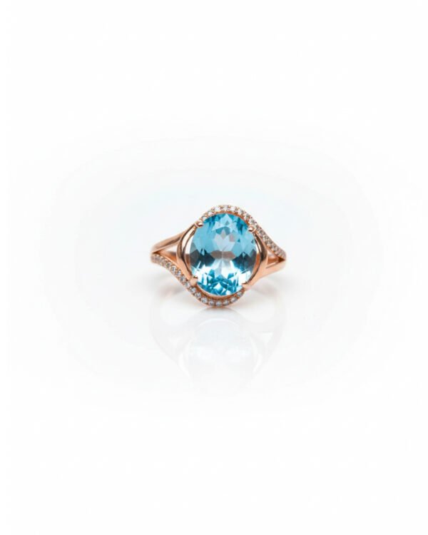 Front view of rose gold plated 925 silver oval blue topaz halo ring with split shank and accent stones – L66648
