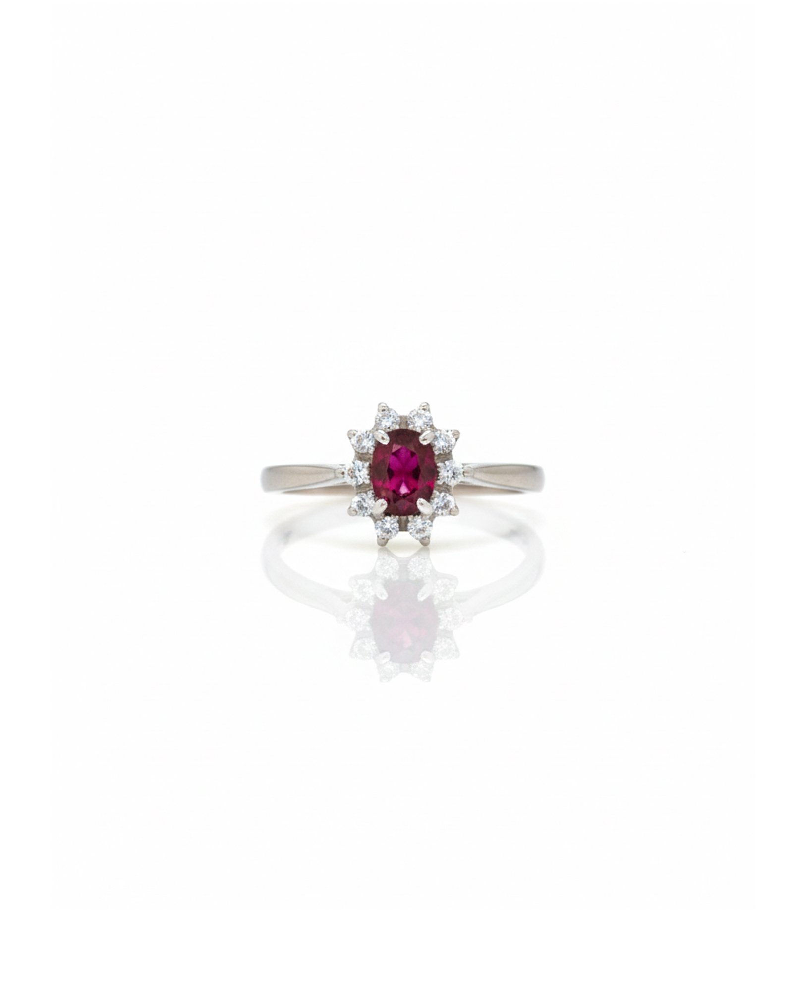 Front view of 925 silver ruby and white sapphire halo cluster ring with oval ruby center and daisy-style floral design