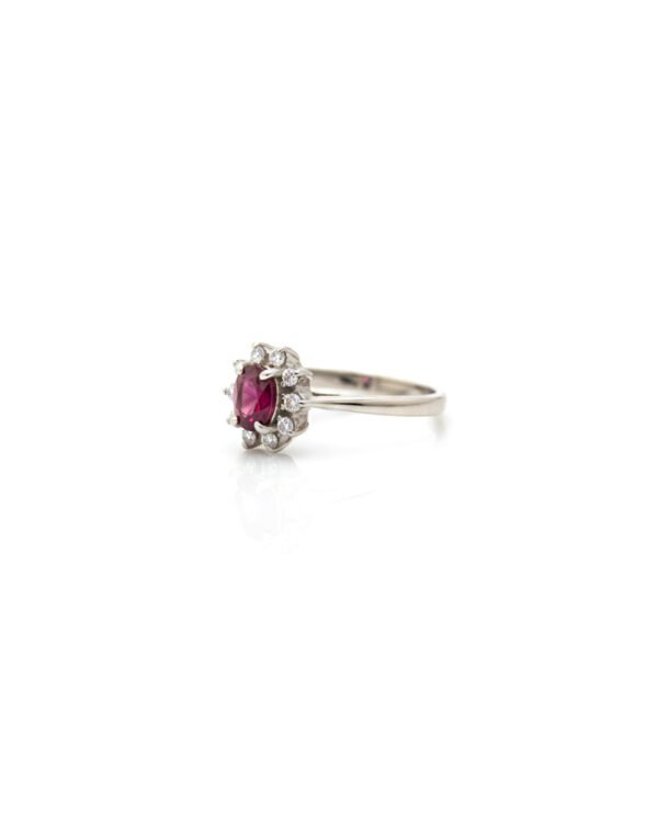 Side view of 925 silver ruby and white sapphire halo cluster ring with daisy design and detailed sterling silver band