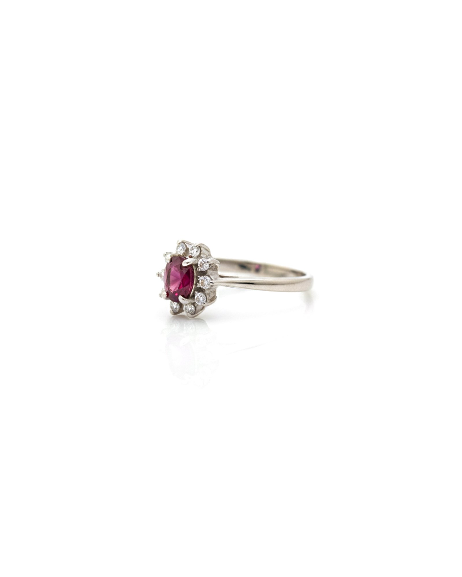 Side view of 925 silver ruby and white sapphire halo cluster ring with daisy design and detailed sterling silver band
