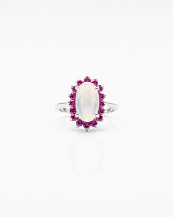 Front view of 925 sterling silver blue moonstone and ruby cluster ring with oval-cut moonstone and ruby halo
