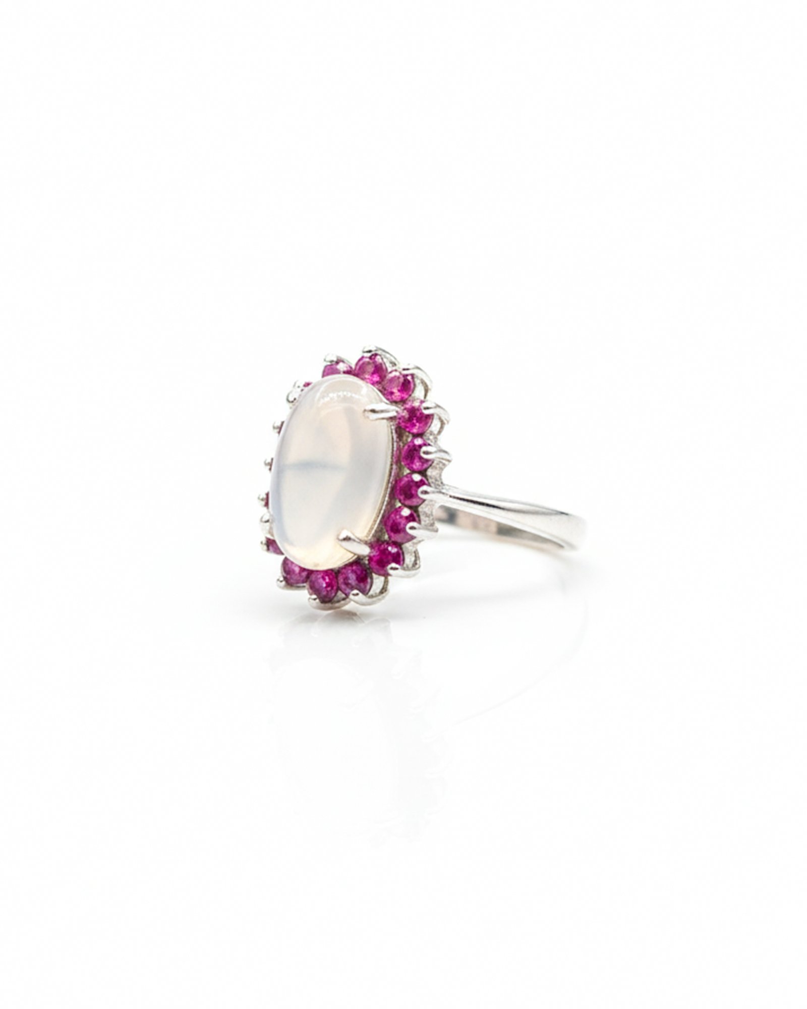Side view of 925 sterling silver blue moonstone and ruby cluster ring showing vintage Victorian setting and band details